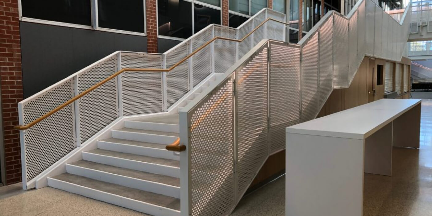 Perforated Aluminum Railing on Stairwell at Carleton College