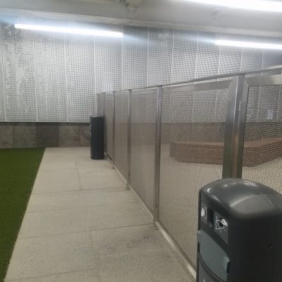Stainless steel infill panel and perforated wall panels for dog enclosure at Minneapolis St Paul Airport