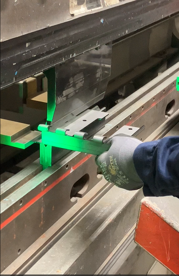 formed part on Astro Metal Craft press brake