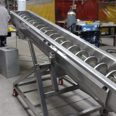 Industrial auger conveyor with jacketed trough for thermal processing
