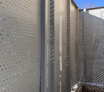 Seeing Through the Options: Louvered vs. Perforated Screen Systems